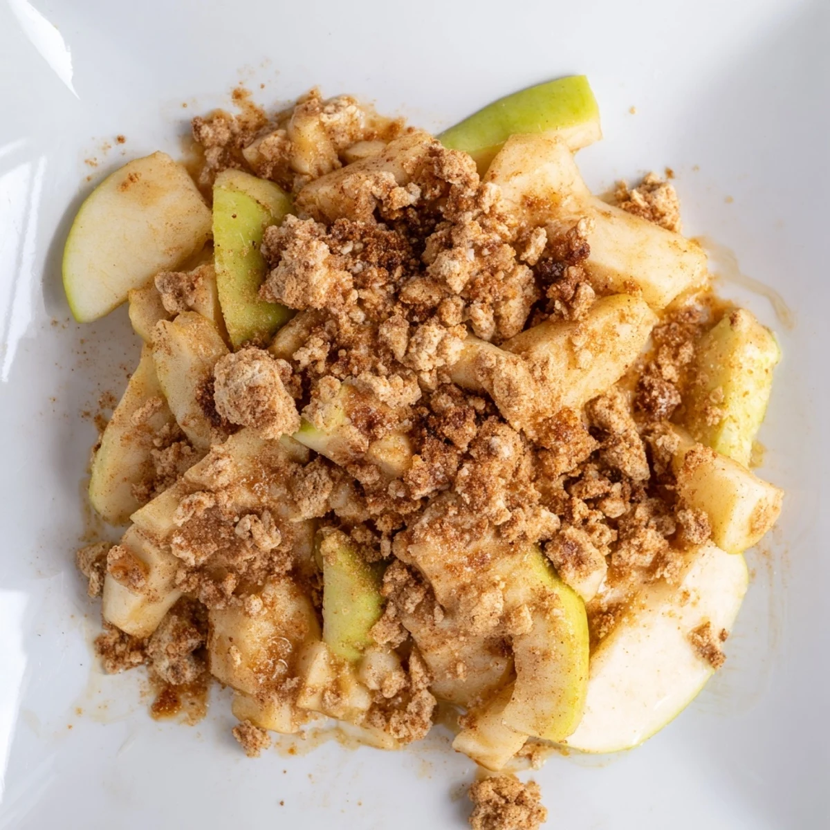 Freshly baked Rustic Apple and Cinnamon Crumb Bake, showcasing a buttery crumb topping and tender apples.