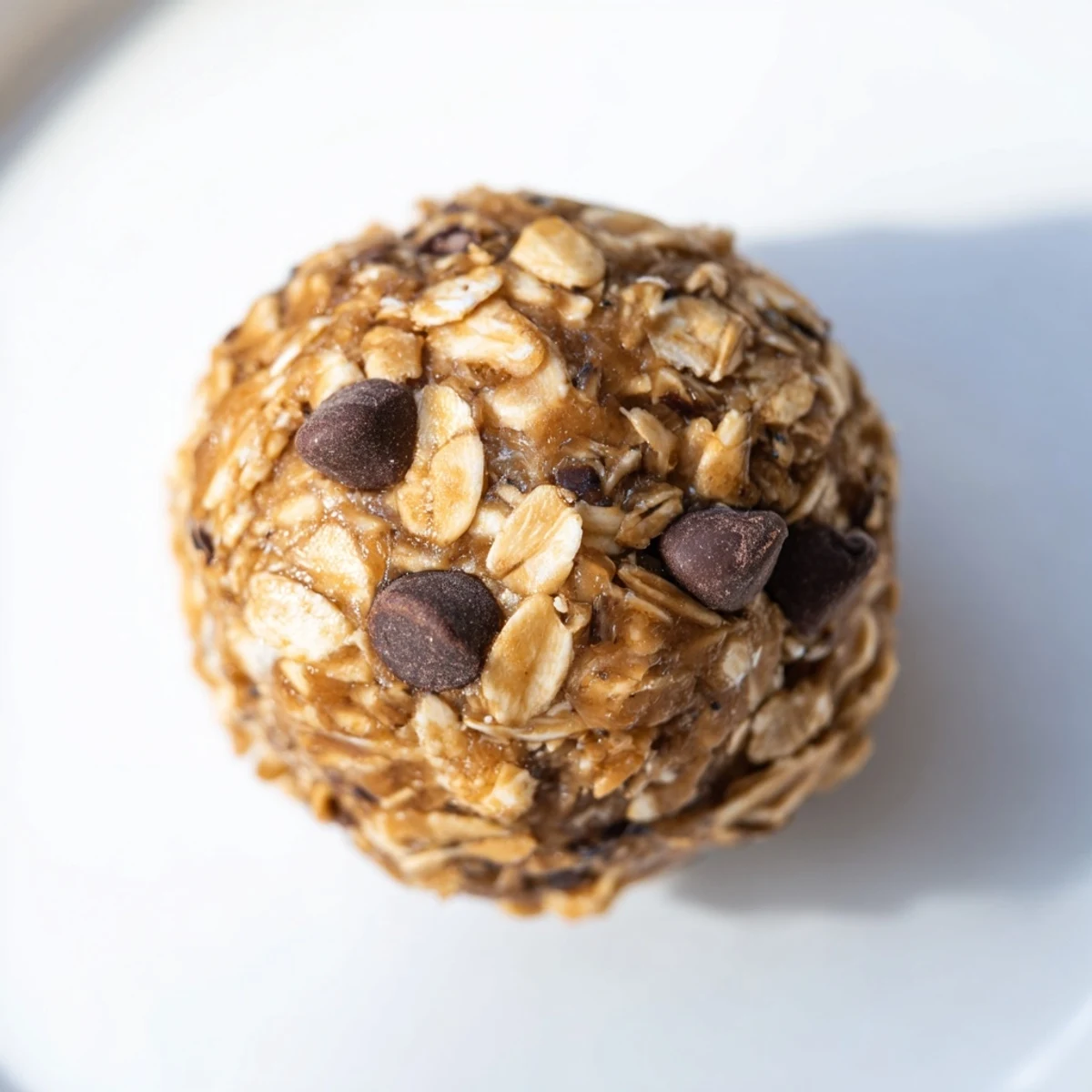 Freshly rolled No-Bake Peanut Butter Energy Balls, a quick and delicious, no-bake snack option.