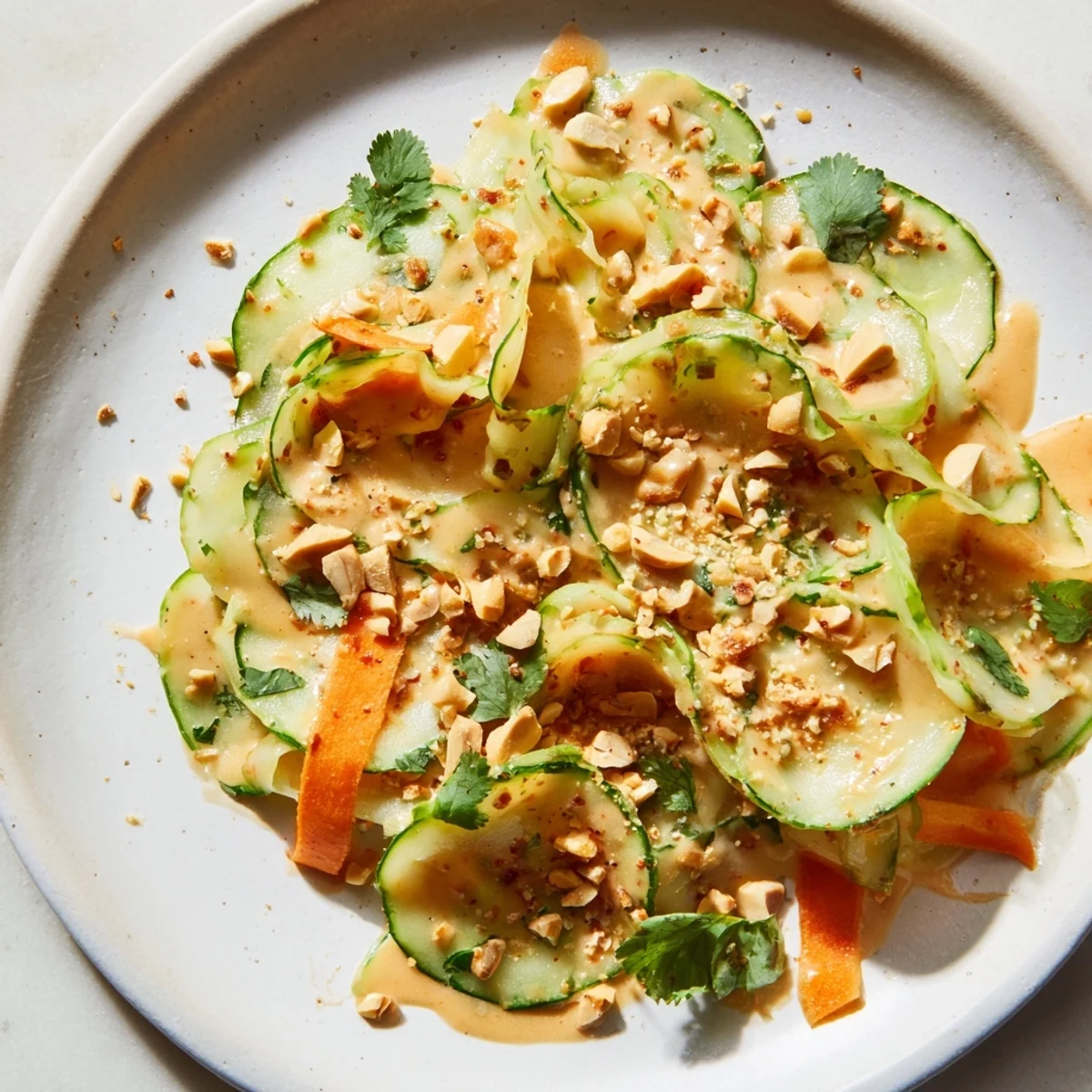 A close-up view of the delicious Thai-Style Peanut Cucumber Salad, bursting with fresh flavors and textures.