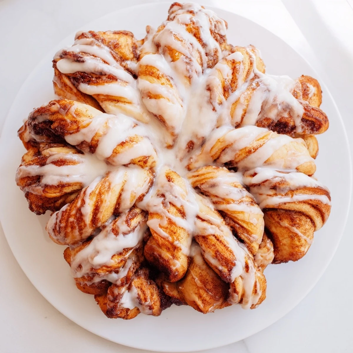Warm, shareable view of the fluffy Cinnamon Roll Pull-Apart Snowflake, perfect for a cozy winter breakfast or dessert.