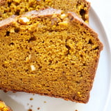 Slice of tender pumpkin bread loaf, perfect for an autumn snack, paired with a steaming cup of coffee.