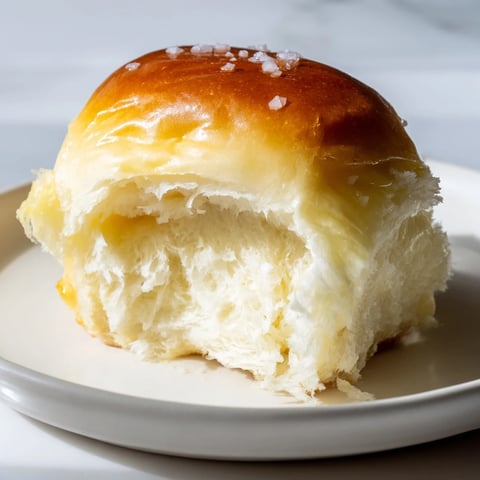 Golden-topped quick-rise dinner rolls, fresh from the oven, ready to serve with melting butter.