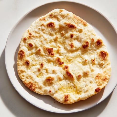 Golden brown three-ingredient easy flatbreads, perfect for scooping up hummus with a delightful texture.