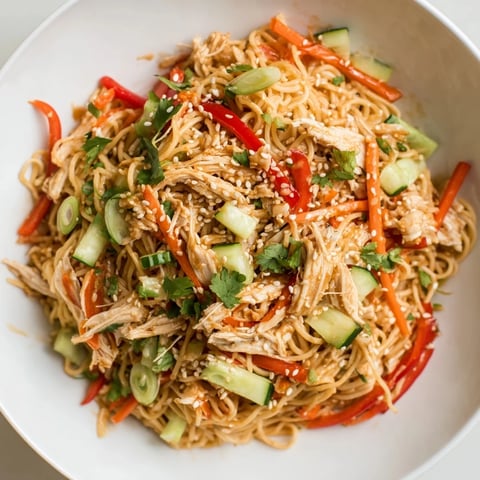 Chilled Chicken Noodle Salad: A vibrant bowl showcasing delicious cold noodles with chicken and vegetables.
