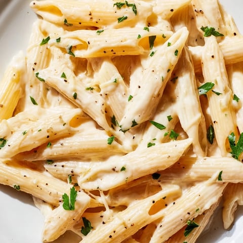 Steaming Creamy Milk Pasta One-Pot in a deep skillet, with a silky Parmesan sauce clinging to al dente penne for a comforting Italian-inspired dinner.  