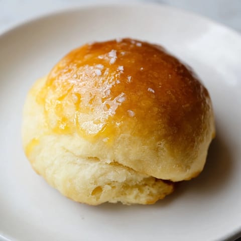 A warm, fluffy batch of quick-rise dinner rolls, perfect for soaking up delicious gravy at dinner.