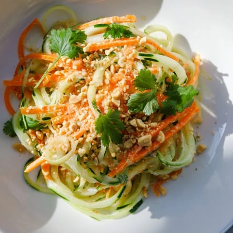 Freshly tossed Thai-Style Peanut Cucumber Salad with peanuts, cilantro, and a zesty, balanced dressing.