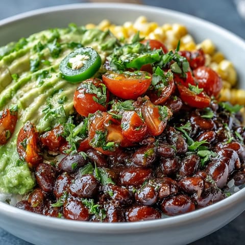 Vibrant Plant-Based Taco Bowl bursting with black beans, avocado, and fresh salsa.