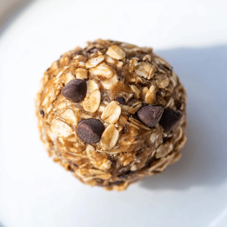Freshly rolled No-Bake Peanut Butter Energy Balls, a quick and delicious, no-bake snack option.
