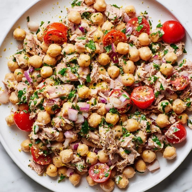 Mediterranean-inspired Dense Chickpea and Tuna Salad, a vibrant mix of flavors with lemon zest.