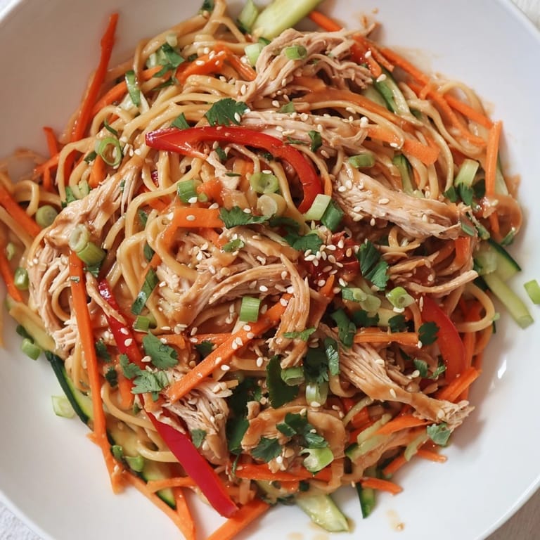 Enjoy this easy Chilled Chicken Noodle Salad, featuring shredded chicken, crisp veggies, and sesame seeds.