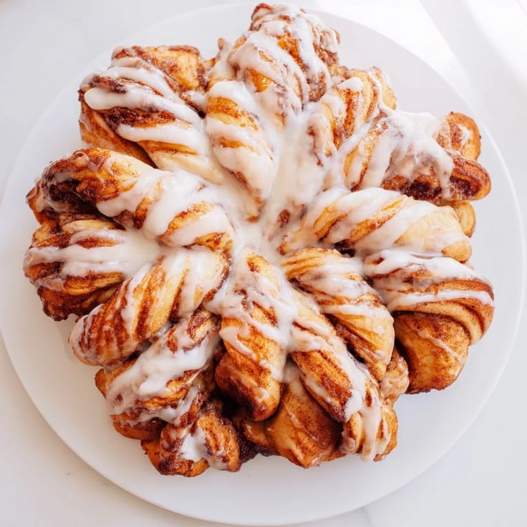 Warm, shareable view of the fluffy Cinnamon Roll Pull-Apart Snowflake, perfect for a cozy winter breakfast or dessert.